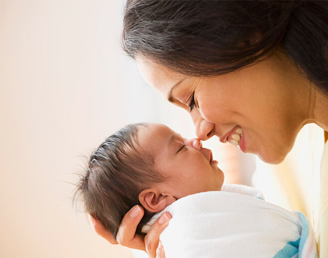 newborn nose touching mom's nose