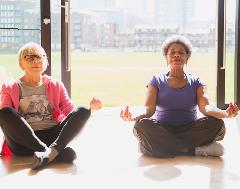 mature women doing yoga