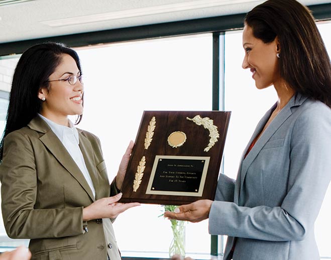 award-executives-applauding-two-women